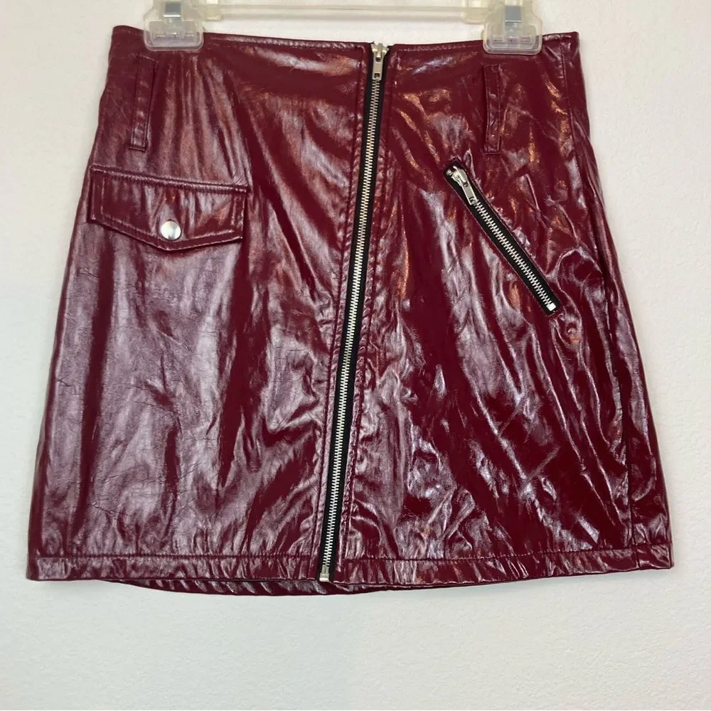 NWT Last Call Burgundy shiny Faux Leather Mini Skirt with Zip front & pocket
